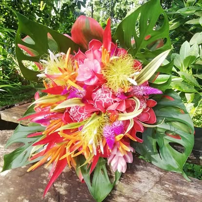 Tropical bouquet with proteas and orchids